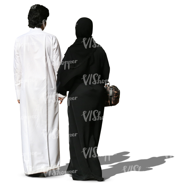 arab couple in traditional clothes walking hand in hand