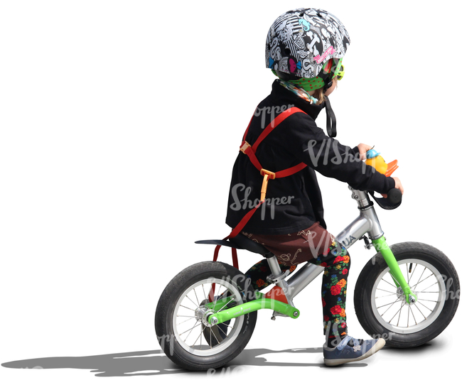 child wearing a helmet riding a likeabike