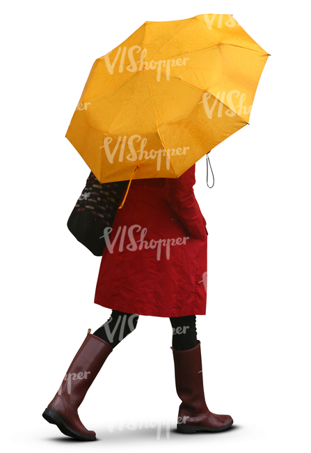 woman with a yellow umbrella walking in the rain