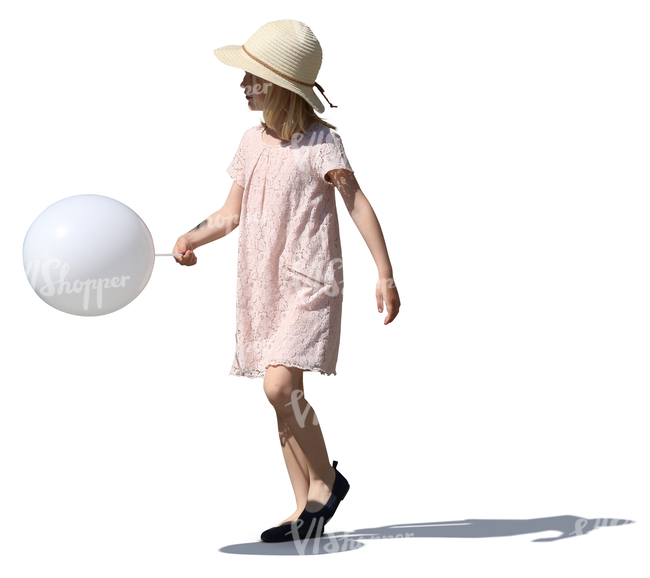 girl in a summer dress walking with a balloon in her hand