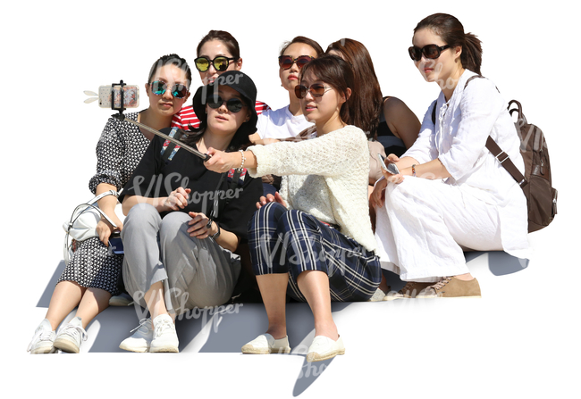 group of asian women sitting on the stairs and taking a selfie