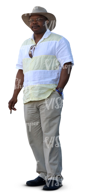 black man with a hat standing and smoking