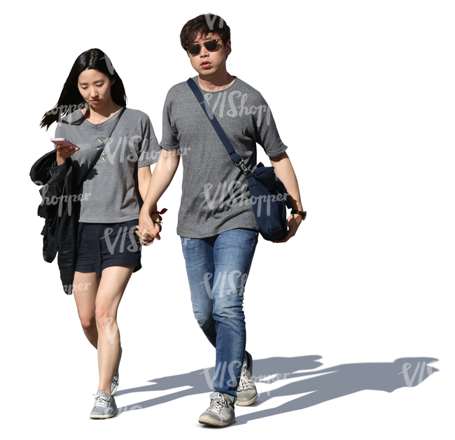 asian couple walking hand in hand