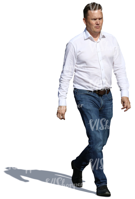 man in a white shirt and jeans walking in sunlight