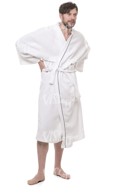 man in a white bathrobe standing in a spa