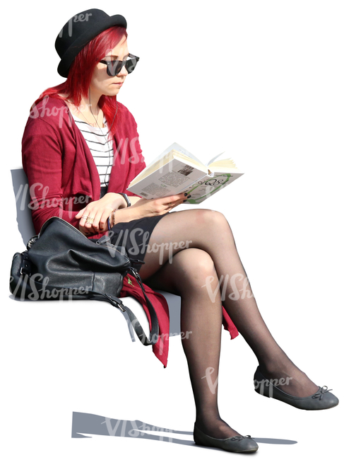 woman with sunglasses sitting outside and reading