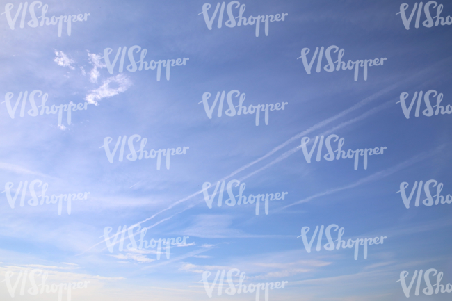 almost clear sky with contrails