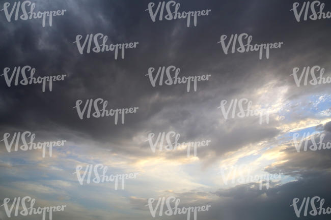 evening sky with large dark cloud