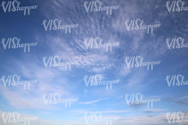 blue daytime sky with some cirrus clouds