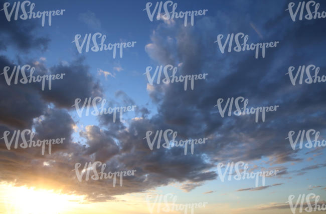 free sky texture of a sunset with dark blue clouds