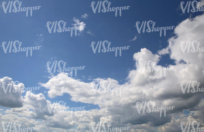 blue sky with white fluffy clouds