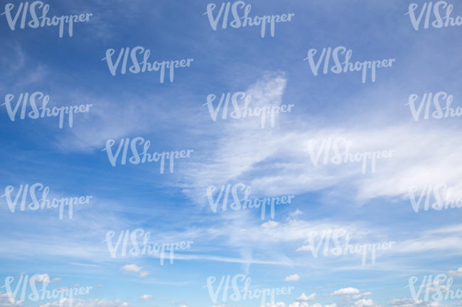 blue sky with different thin clouds