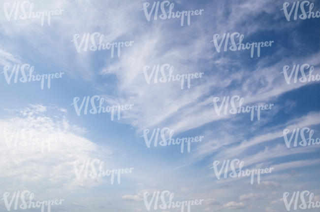 daytime sky with stripes of clouds