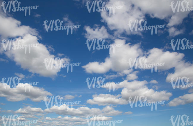 deep blue sky with fluffy clouds