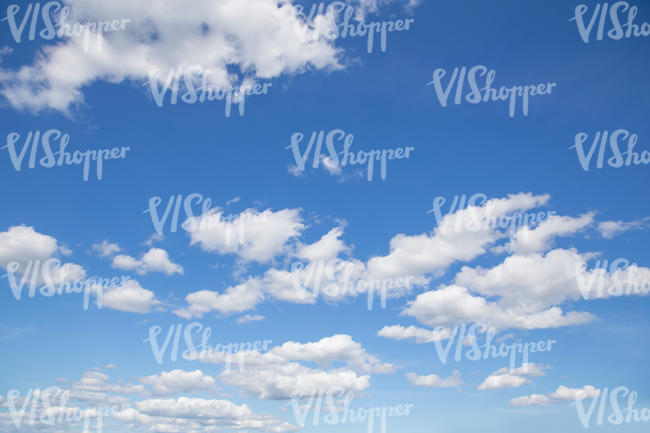 daytime sky with white cumulus clouds