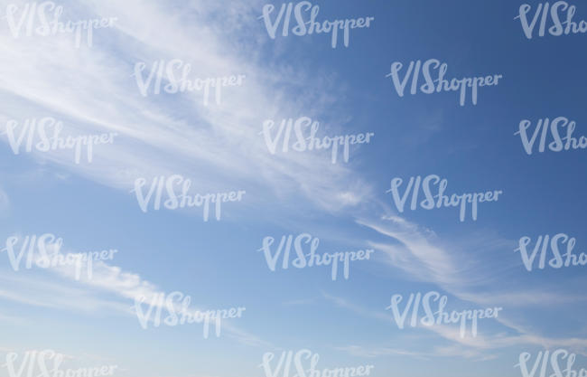 light blue sky with some stripes of clouds