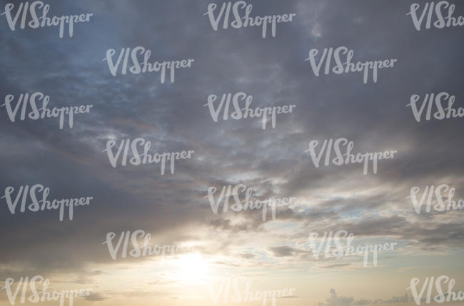 evening sky with clouds and sun