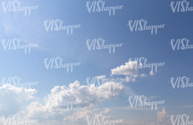 daytime sky with few cumulus clouds