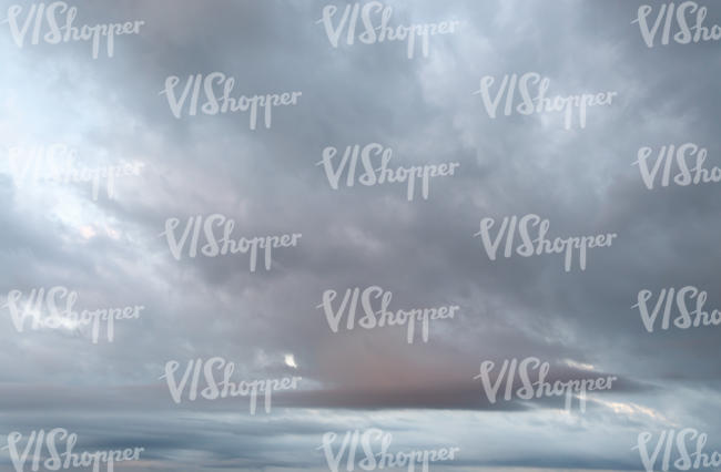 daytime sky with light grey clouds