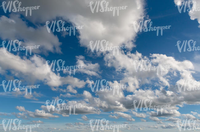 blue sky with many cumulus clouds