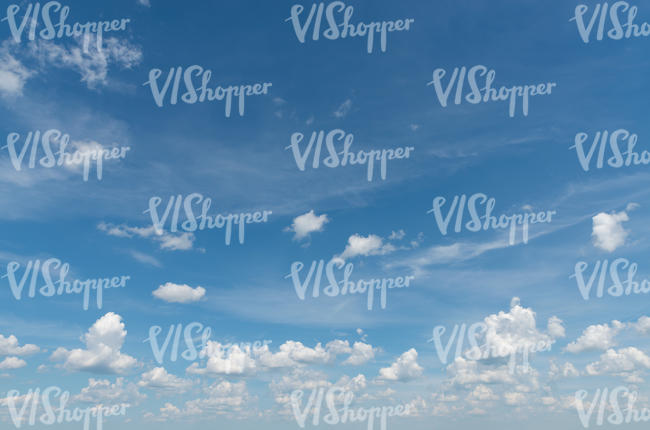 daytime sky with small fluffy clouds