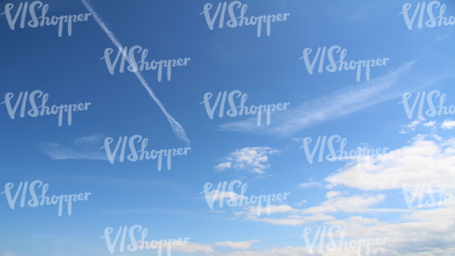 blue sky with clouds and contrails