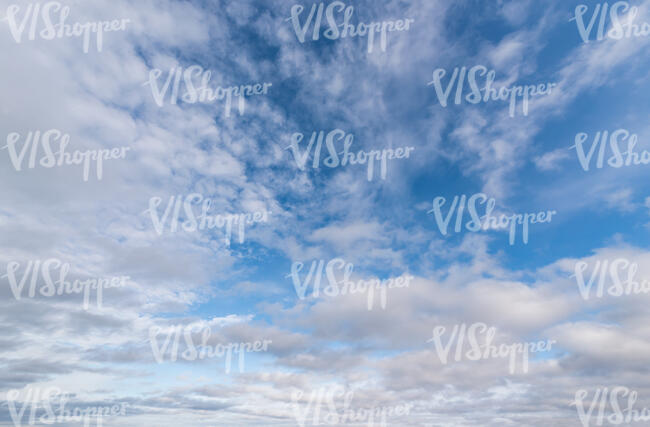 daytime sky with many scattered clouds