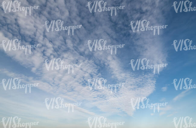 blue sky with thin white clouds