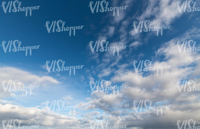 deep blue daytime sky with some white cloud areas