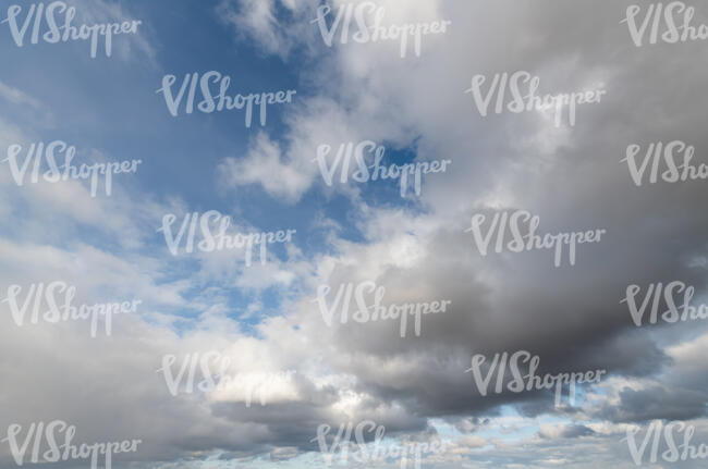 daytime sky with fluffy large clouds