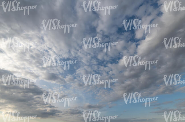 daytime sky with densely scattered clouds