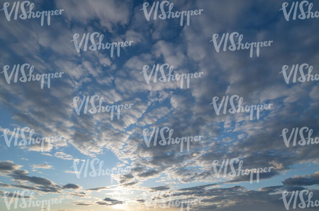 evening sky with layer of scattered clouds
