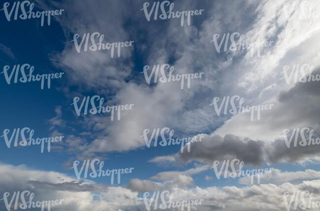 daytime sky with large white clouds