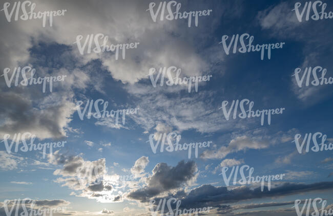 daytime sky with sun behind the clouds