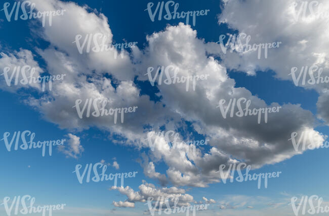 daytime sky with clustered clouds