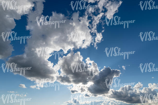 sky image with sun behind clouds