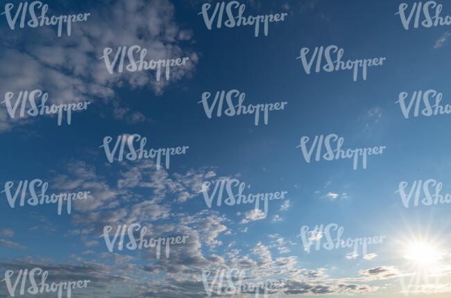 afternoon sky with small clouds