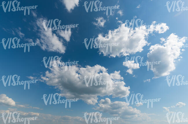 blue sky with medium size white clouds