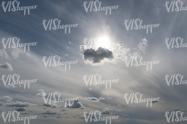 hazy sky with a backlit cloud