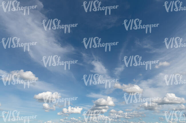 blue daytime sky with different small clouds 