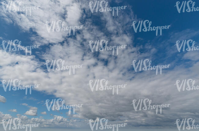 blue sky with large white clouds
