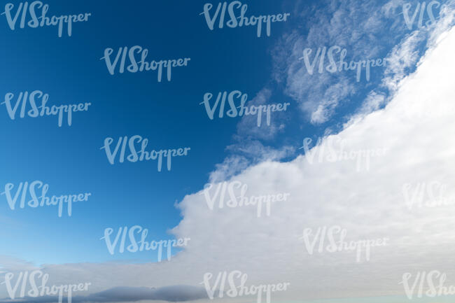 blue sky with one large white cloud