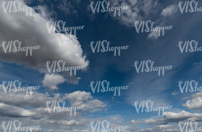 deep blue sky with white clouds