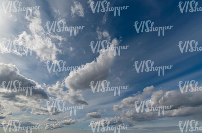 daytime sky with different white clouds