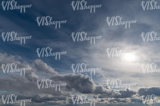 daytime sky with sun above the clouds