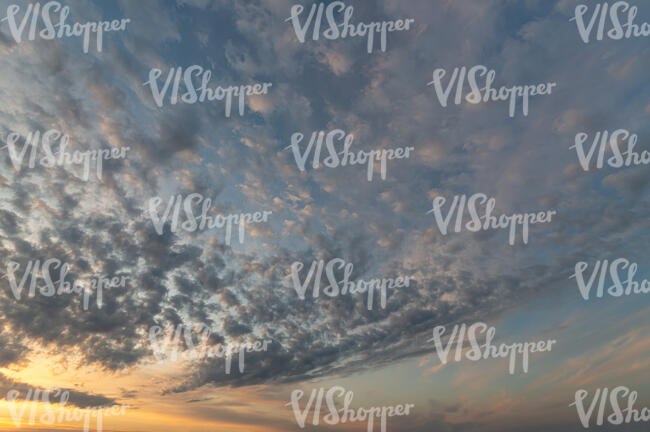 sunset sky with scattered little clouds