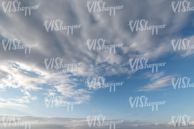 daytime sky with large white cloud