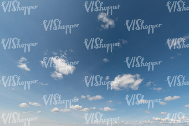 cut out blue daytime sky with few little cute clouds