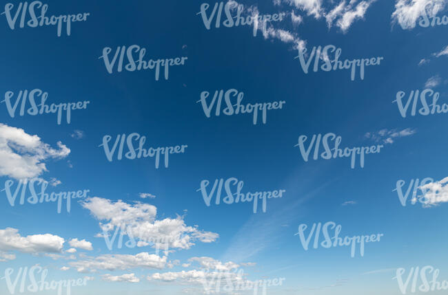 deep blue sky with tiny clouds