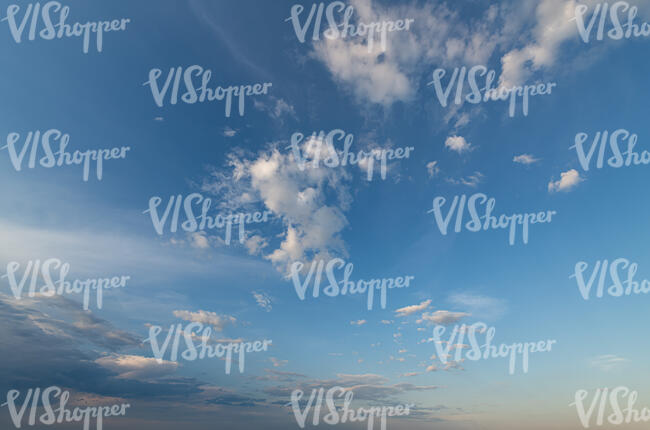 daytime sky with few little white clouds